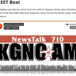 Photo of black and orange KGNC AM news talk show speaking with Dr. Gaymen Helman on air during the Creet Beat feature.