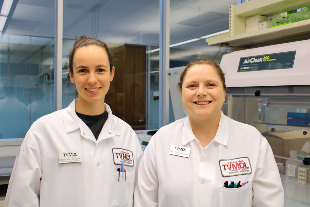 two women in white lab coats